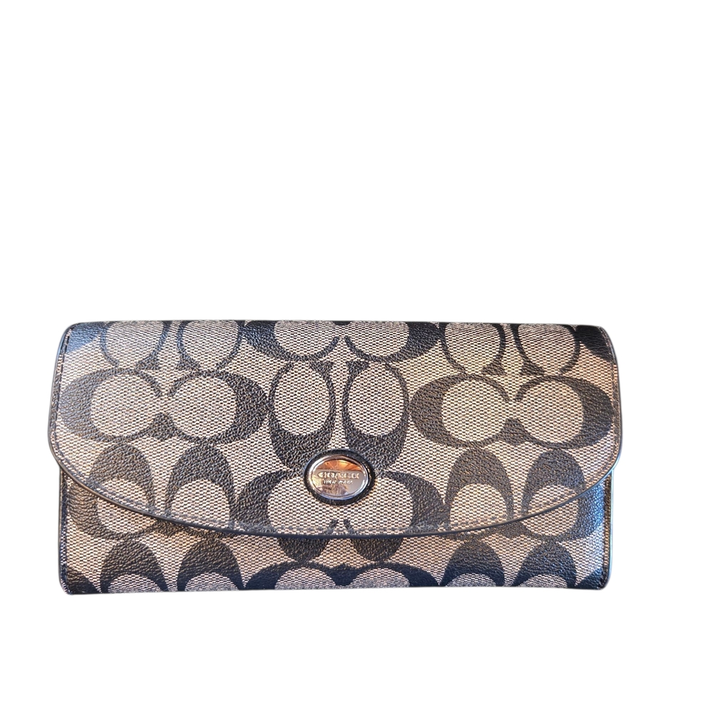 Coach Black and Tan Clutch with Signature Design